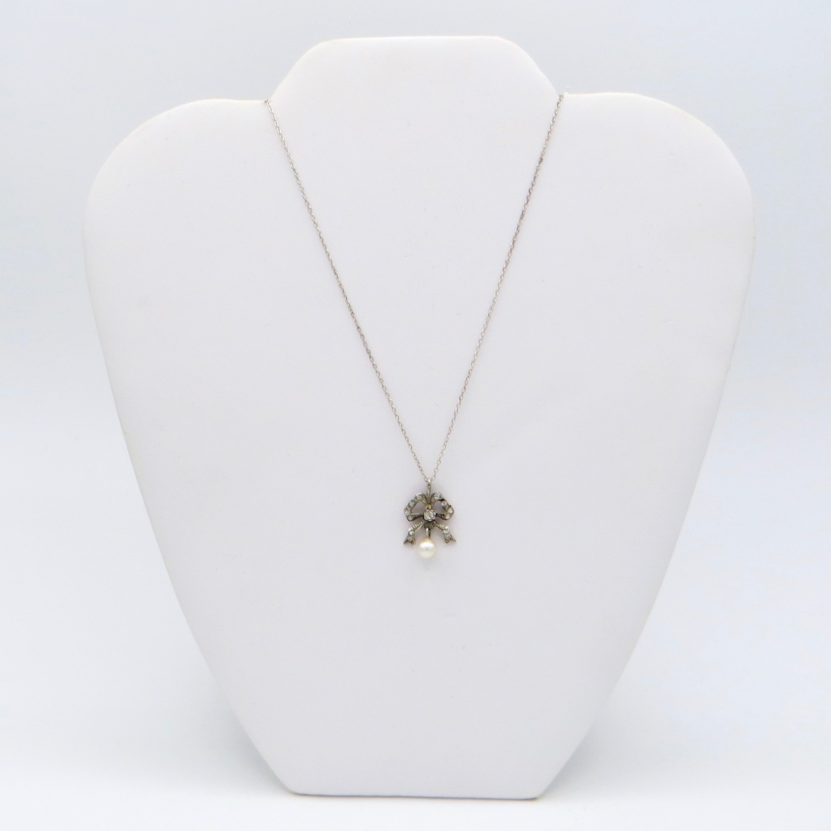Sterling Silver Bow Necklace with Hanging Pearl