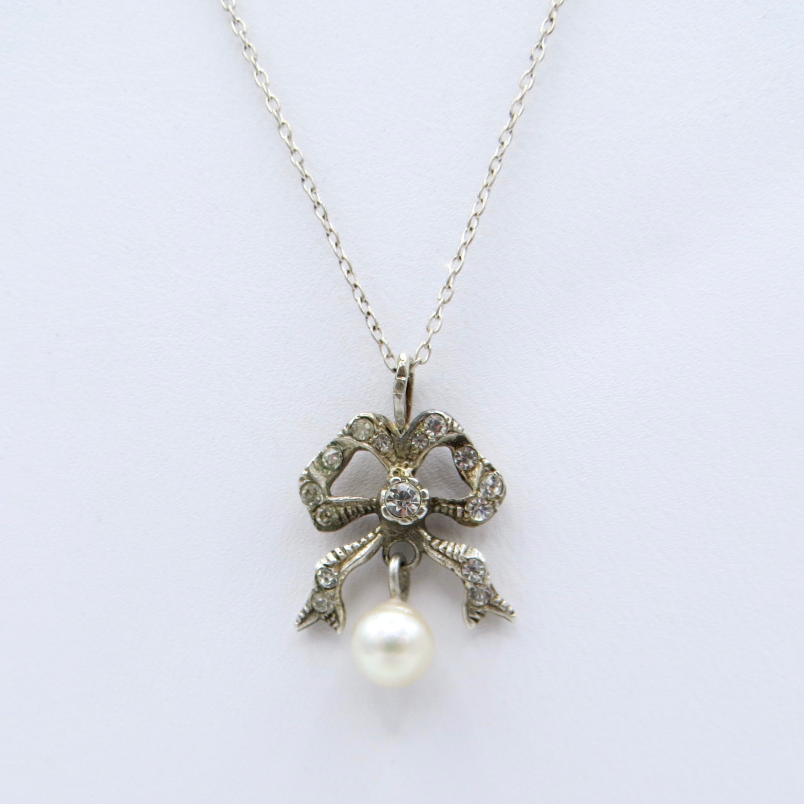 Sterling Silver Bow Necklace with Hanging Pearl