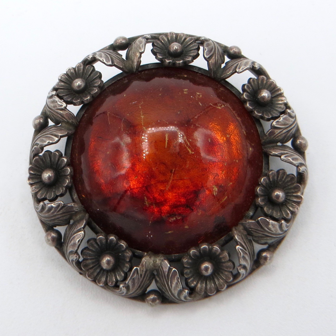 N. E. From Amber Brooch