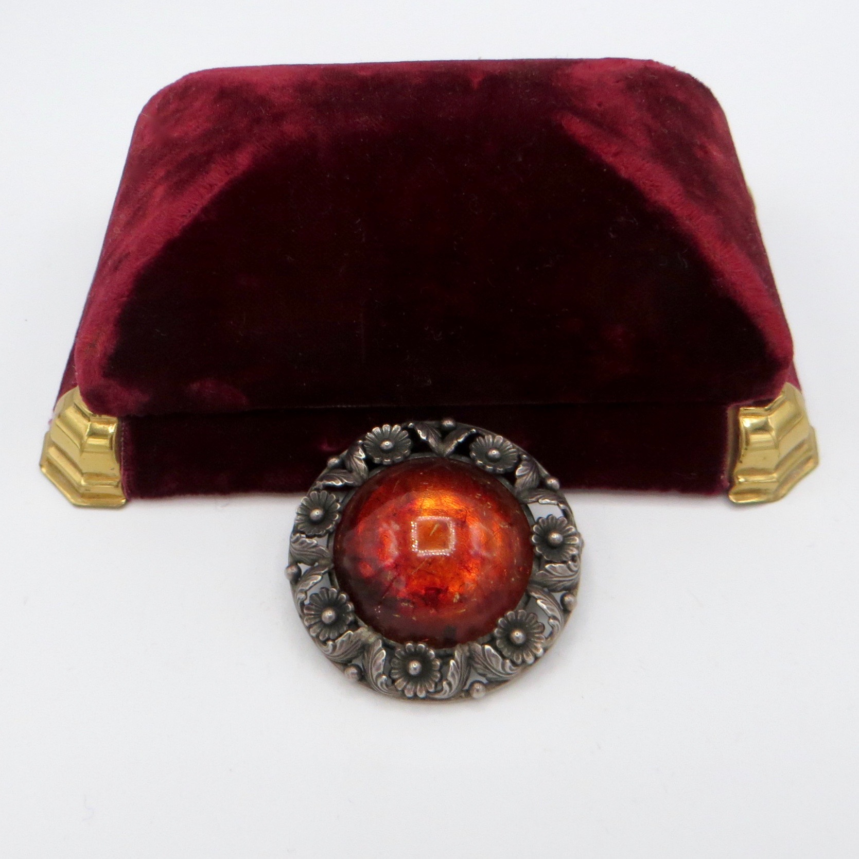 N. E. From Amber Brooch
